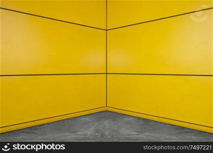 Yellow square layout design wall with cement floor