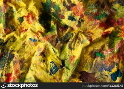 yellow stained fabric with paint background