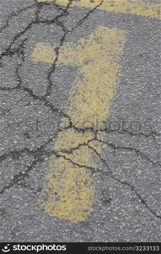 Yellow stenciled one on the road