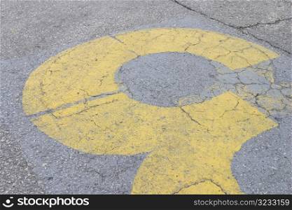 Yellow stenciled three detail on road