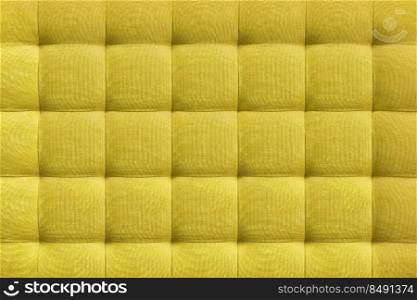 Yellow suede leather background for the wall in the room. Interior design, headboards made of furniture fabric, furniture upholstery. Classic checkered pattern for furniture, wall, headboard. Yellow suede leather background, classic checkered pattern for furniture, wall, headboard