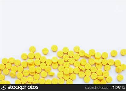 Yellow tablets of Paracetamol on white background. Copy space