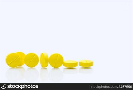 Yellow tablets pills on white background. Prescription drugs. Pharmaceutical industry. Healthcare and medicine. Pharmacy drugstore web banner. Tablets pills manufacturing industry. Healthcare industry