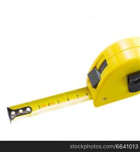 Yellow tape measure close up isolated on white background