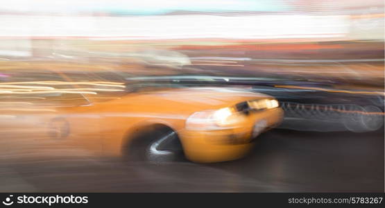 Yellow taxi moving on a street, Times Square, Manhattan, New York City, New York State, USA