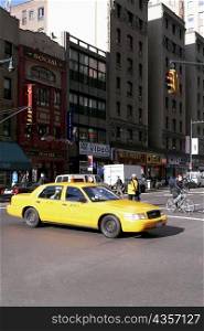 Yellow taxi on a road, New York City, New York State, USA