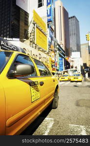 Yellow taxi on a road, Times Square, Manhattan, New York City, New York State, USA