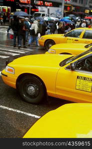 Yellow taxi waiting at the zebra crossing