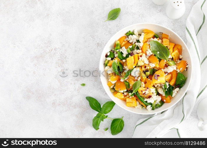 Yellow tomato salad with green paprika, cottage cheese and basil. Healthy food, diet. Top view