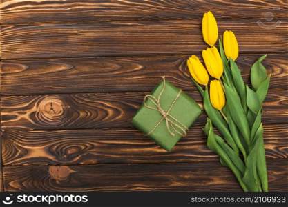 yellow tulip flowers with gift box table