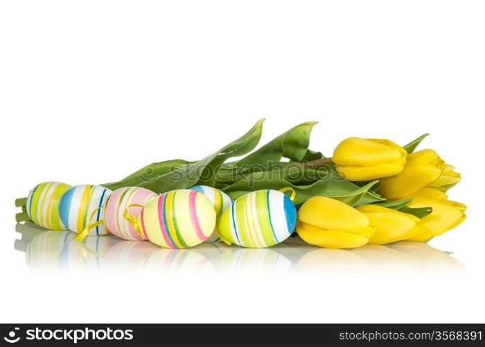 Yellow tulips and Easter eggs on the white background