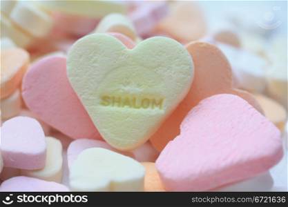 yellow valentine candy heart with Shalom text