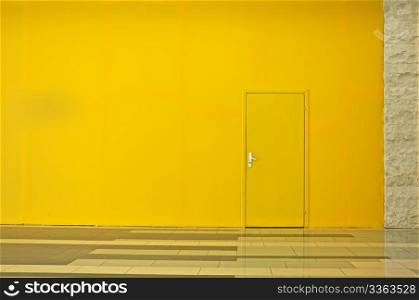 Yellow wall with a door. Horisontal background