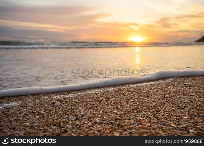 Yellow warm sand and summer sea with blue sky and copy space. Sea view during daytime with blue sky and white clouds. Summer season concept.