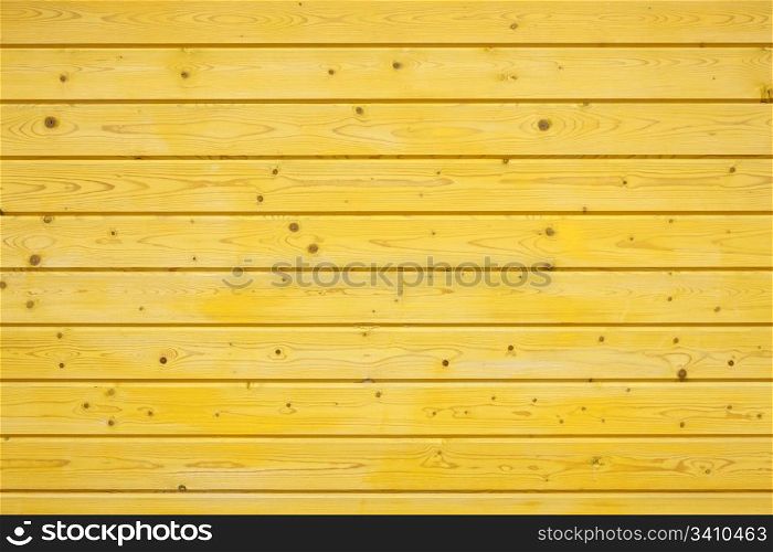 yellow wooden fence made of pine wood
