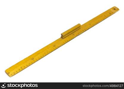 Yellow wooden measuring ruler on a white background. Yellow wooden measuring ruler on a white background.