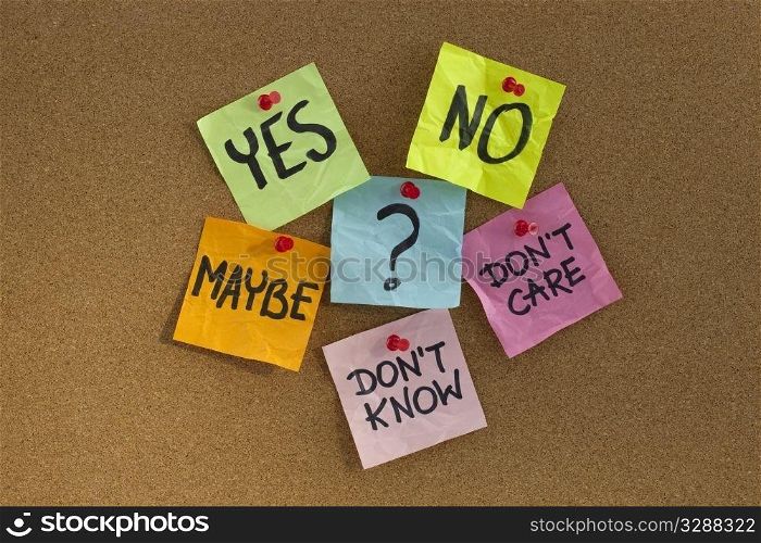 yes, no, maybe, ... undecided voter concept, colorful sticky notes on cork bulletin board