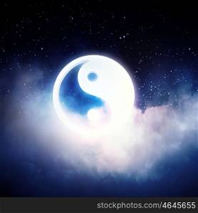 Yin yang symbol. Yin Yang sign in dark night sky