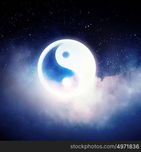 Yin yang symbol. Yin Yang sign in dark night sky