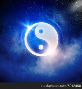 Yin yang symbol. Yin Yang sign in dark night sky