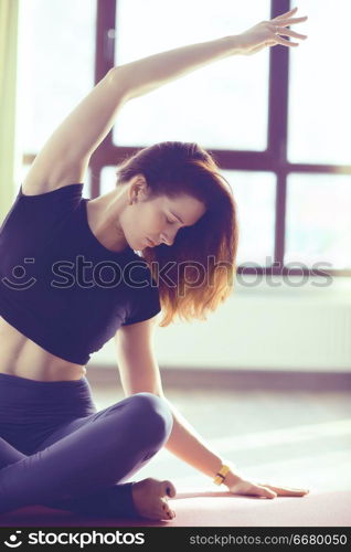 yoga balance girl / Yoga coach shows balance, yoga postures. Beautiful sporty graceful girl in the gym