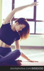 yoga balance girl / Yoga coach shows balance, yoga postures. Beautiful sporty graceful girl in the gym