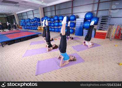 yoga exercise with group of girls