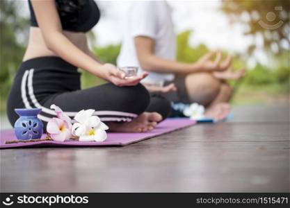 Yoga fitness lifestyle healthy woman relaxation doing a meditation. Yoga meditating outdoor with zen on sitting position. Young exercise concept.