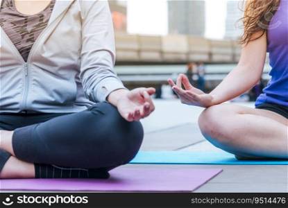 Yoga fitness lifestyle healthy woman relaxation doing a meditation. Yoga meditating outdoor with zen on lotus sitting position. Young woman workout outdoor exercising on bright sunny outside