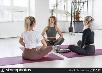 yoga instructor teaching women