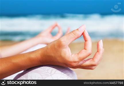 Yoga meditation on the beach, healthy female in peace, soul and mind zen balance concept