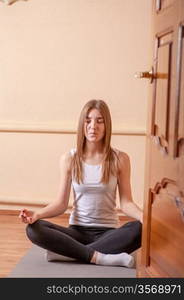 yoga meditation pretty blond in studio