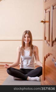 yoga meditation pretty blond in studio