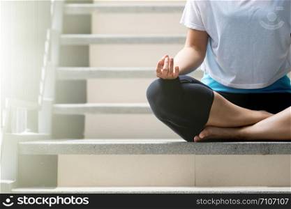 Yoga on the staircase, Close up hands, healthy lifestyle, wellness, well being, wearing sportswear