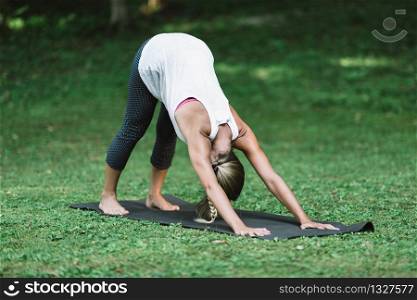 Yoga, sun salutation, downward facing dog