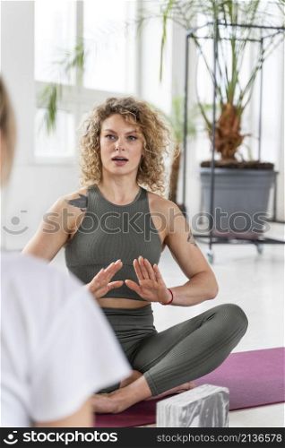 yoga teacher explaining