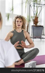 yoga teacher explaining