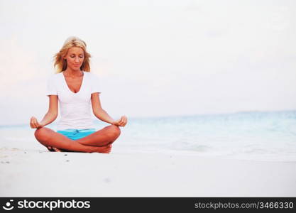 yoga woman on sea coast