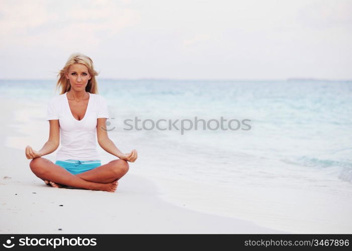 yoga woman on sea coast