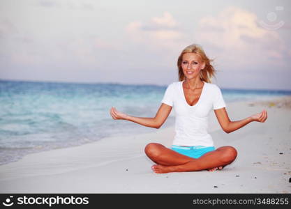 yoga woman on sea coast