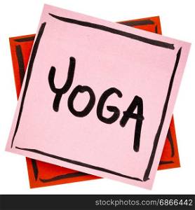yoga word - handwriting in black ink on an isolated sticky note