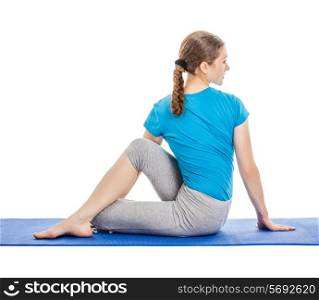 Yoga - young beautiful slender woman yoga instructor doing Half Lord of the Fishes Pose (Half Spinal Twist Pose) (Ardha Matsyendrasana) asana exercise isolated on white background