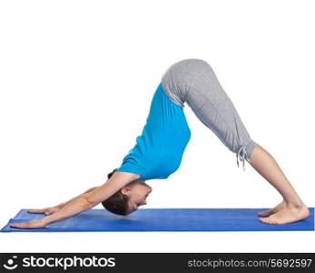 Yoga - young beautiful woman yoga instructor doing downward facing dog pose (adho mukha svanasana) exercise isolated on white background