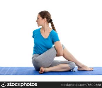 Yoga - young beautiful woman yoga instructor doing Half Spinal Twist Pose (or Half Lord of the Fishes Pose - ardha matsyendrasana) exercise isolated on white background
