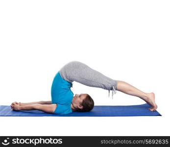 Yoga - young beautiful woman yoga instructor doing Plow pose asana (halasana) exercise isolated on white background