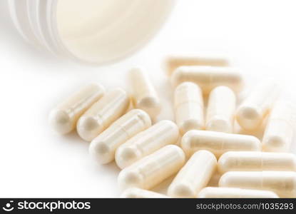 Yoghurt capsules isolated on a white background. Yoghurt Capsules aid in maintaining a normal healthy gastrointestinal system and digestive function.