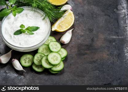 Yoghurt sauce tzatziki with cucumber, garlic, dill. Herbs and vegetables