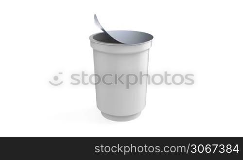 Yogurt cup rotates on white background
