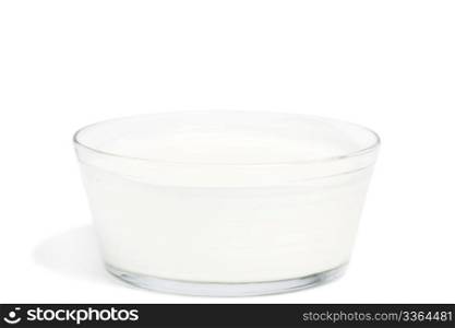 yogurt in a glass bowl. yogurt in a glass bowl on white background
