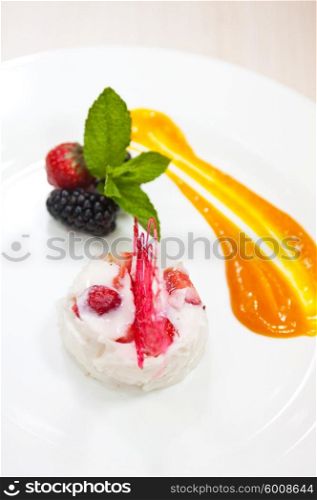 yogurt souffle closeup. souffle from yogurt with strawberry and blackberry